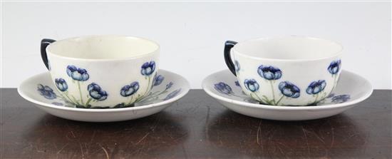 2 Macintyre Burslem Blue Poppy pattern white ground cups/saucers, early 20th C saucer 14cm, one cup & saucer restored(-)